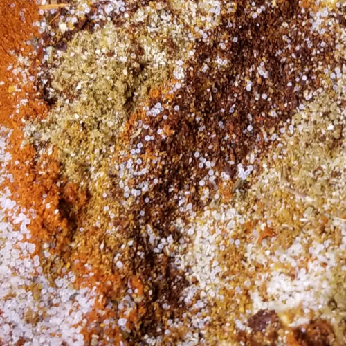 A close up of southwest seasoning not yet fully mixed in a bowl.