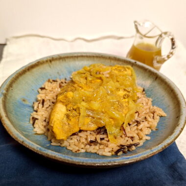 Instant pot honey chicken curry over wild rice with extra curry sauce.
