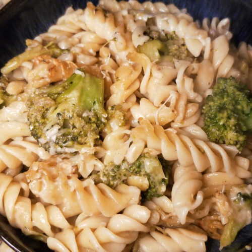 broccoli pine nut pasta served in a bowl.