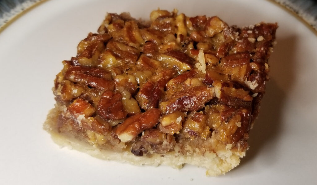 Close up of a pecan pie bar. 