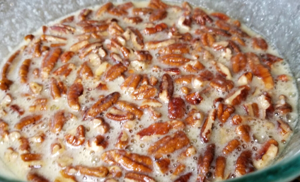 Pecan mixture uncooked in a bowl.