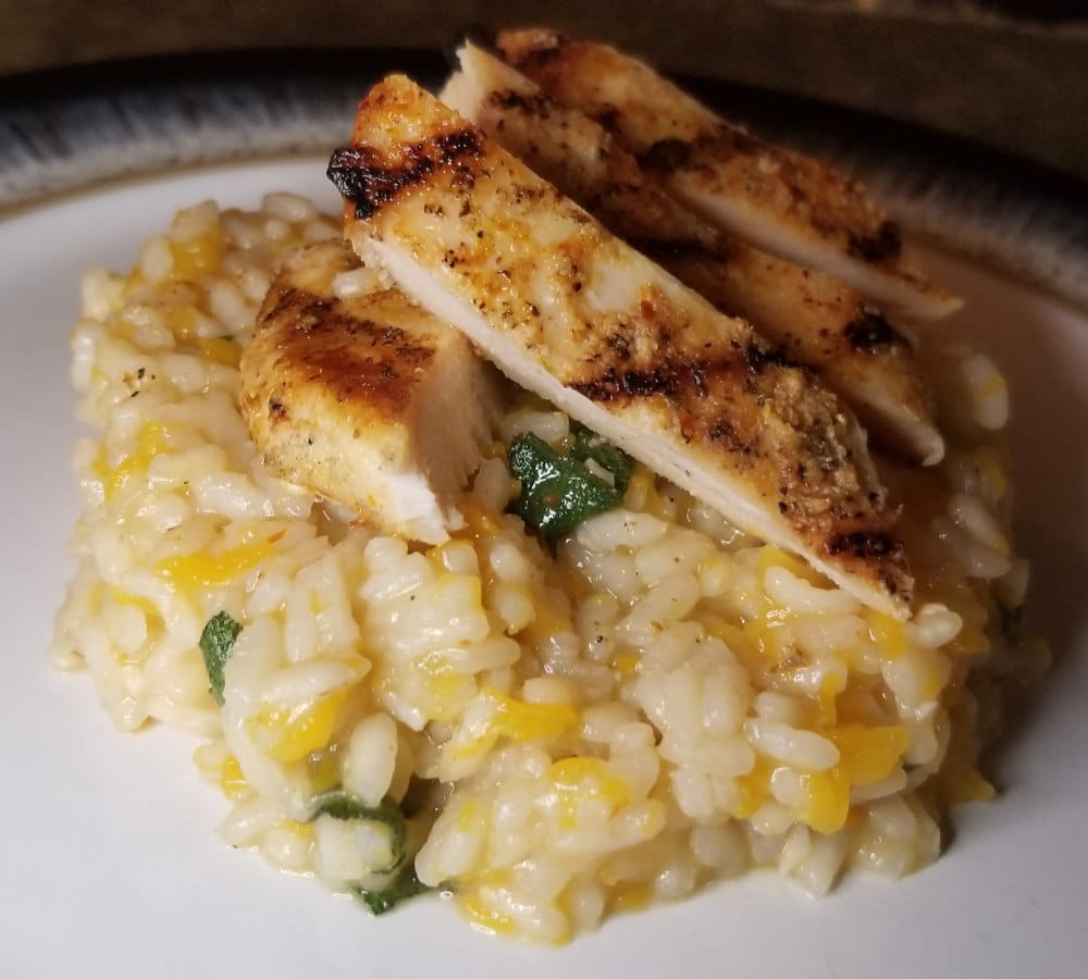 A close up of squash risotto with chicken