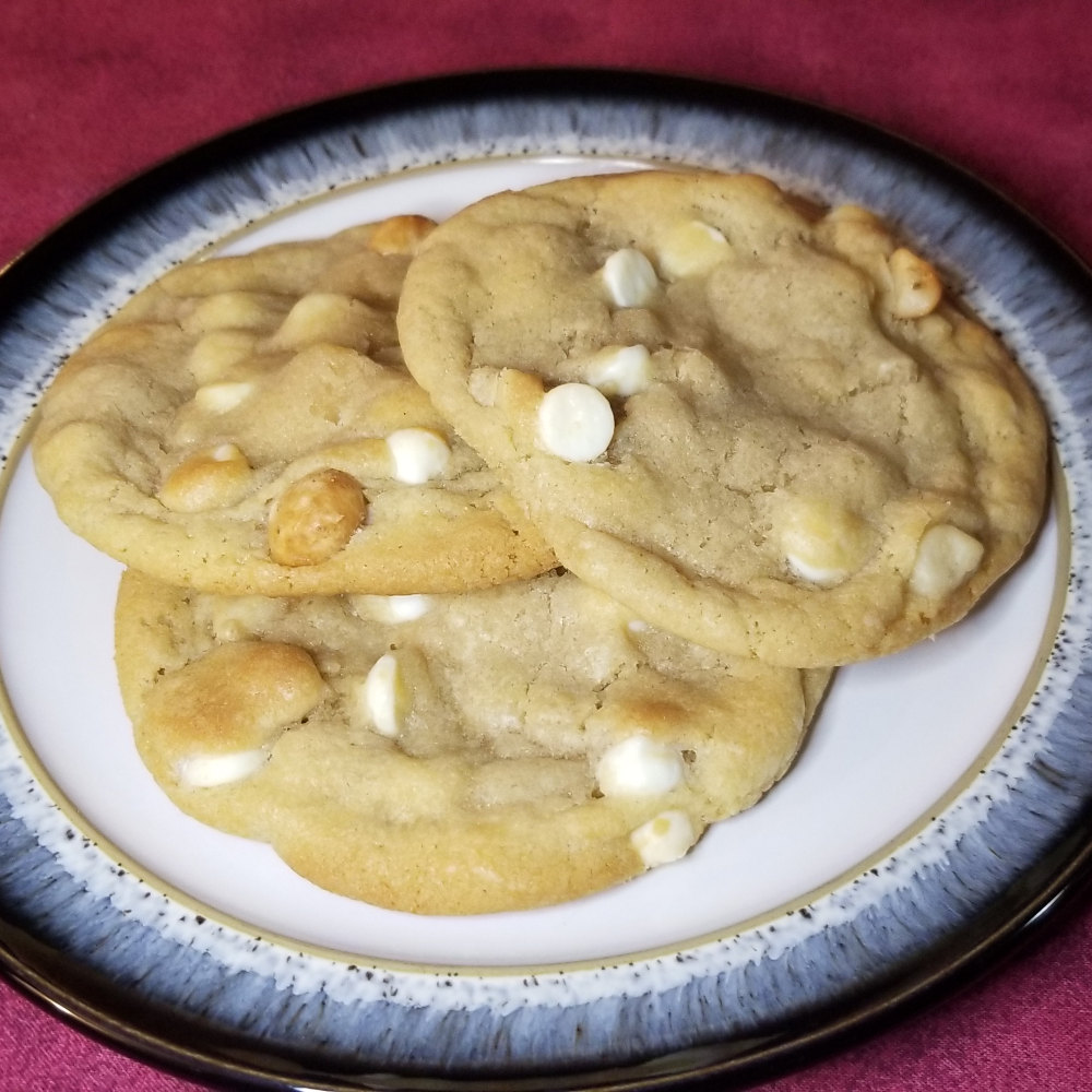 White chocolate chip macadamia nut cookies on a plate.