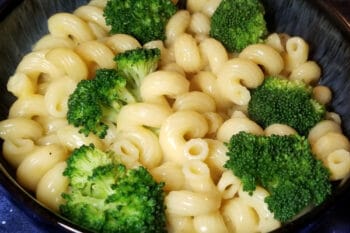 Instant pot macaroni and cheese with broccoli in a bowl.
