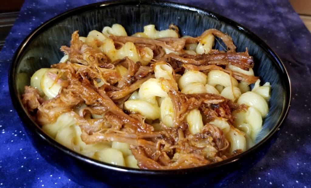 Mac and cheese with barbecued pulled pork. 