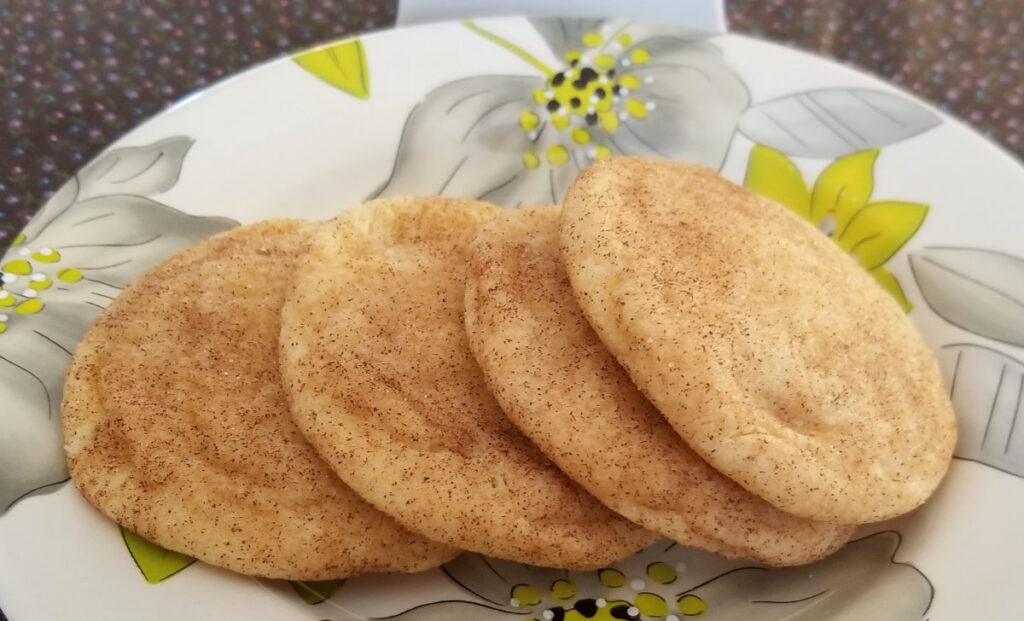 cinnamon sugar cookies leaning against each other in a row. 