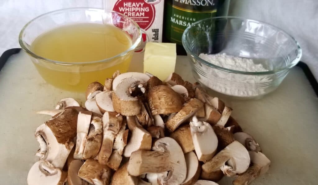 Mushroom marsala ingredients: heavy cream, marsala wine, chicken or vegetable stock, flour, butter, and mushrooms.