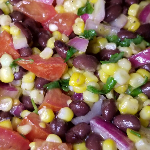 A close up of mixed bean and corn salad.