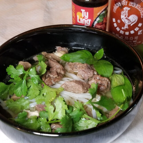 Meat scrap pho with thai basil and cilantro,