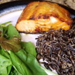 Honey dijon air fryer salmon with wild rice and a mixed greens salad