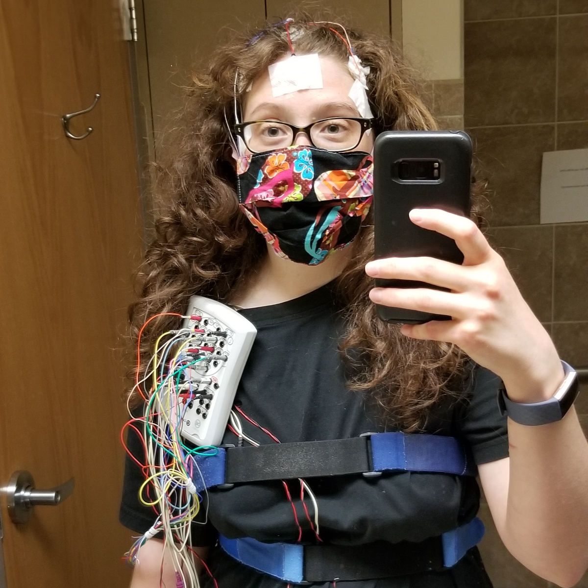 Me ready for my sleep study, hooked up to a lot of wires with straps around my chest and diaphragm